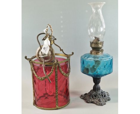 Victorian design gilt metal and cranberry ceiling light, together with an early 20th century single oil burner lamp, with blu