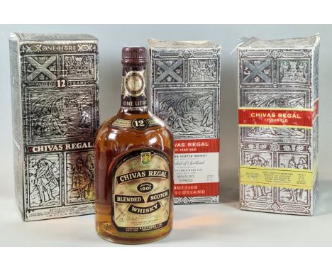 Three bottles of Chivas Regal Twelve Year Old Scotch Whisky. In original boxes, 1L and two marked 26 2/3fl ozs. (3) (B.P. 21%