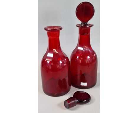 Pair of 19th century, possibly French, ruby red glass mallet shaped decanters and stoppers. 29cm high approx. (2) (B.P. 21% +