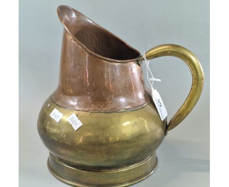 Late 19th/early 20th century copper and brass helmet shaped single handled pitcher jug. 23cm high approx. (B.P. 21% + VAT)