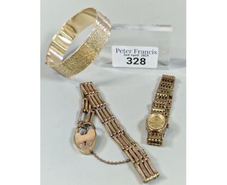 9ct rolled gold bark design bangle, together with a ladies Rotary quartz bar gate wristwatch and a Victorian four bar gate br