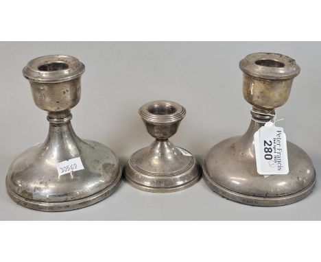 Pair of silver loaded dwarf candlesticks, together with another silver loaded dwarf candlestick. (3) (B.P. 21% + VAT)