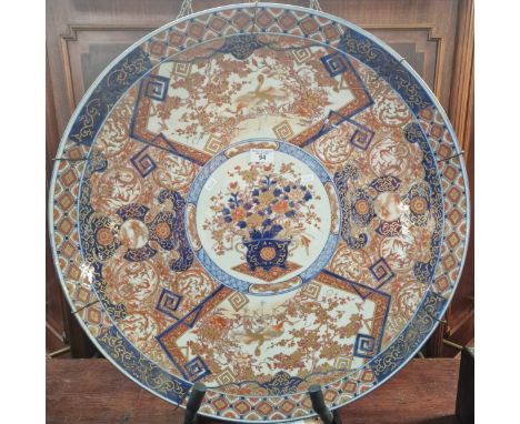 Large Japanese Imari porcelain charger, probably Meiji period, overall decorated with panels of Cranes amongst flowers and fo