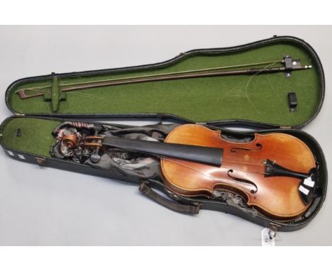 Stradivarius copy violin having two piece back with double scribed outline, complete with bow in fitted case. Back length 35.
