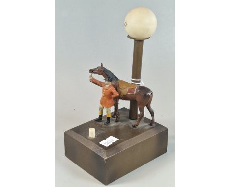 Vintage novelty battery operated table lamp in the form oh a huntsman with his mount. 18cm high approx.  (B.P. 21% + VAT)