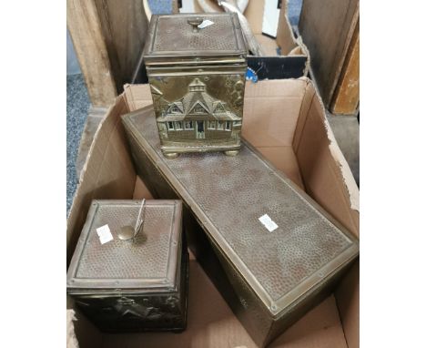 Pair of beaten brass tea caddies and covers depicting relief architectural building/cottage, together with a rectangular beat
