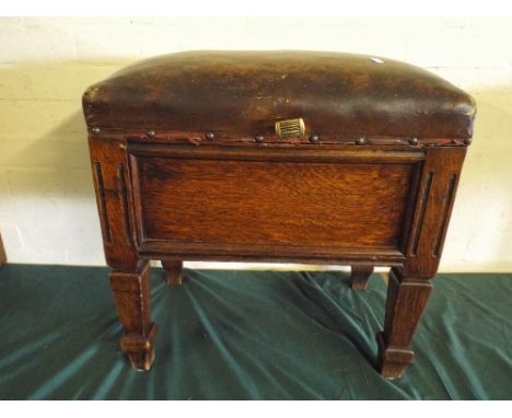 An Oak Lift Top Box Stool with Hide Upholstery. 