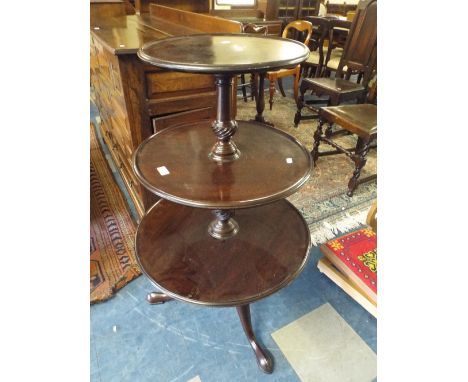 A 19th Century Mahogany Three Tiered Dumb Waiter on Tripod Base. 