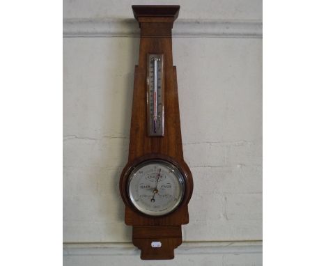 An Art Deco Walnut Wall Barometer with Temperature Scale by Short and Mason, London.