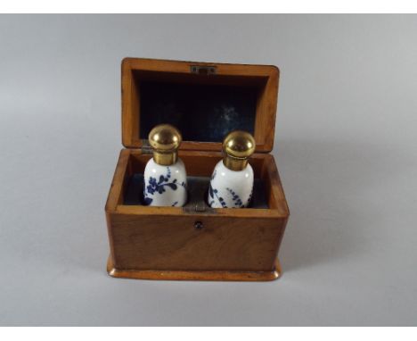 An Olive Wood Box Containing Two Ceramic Scent Bottles. 