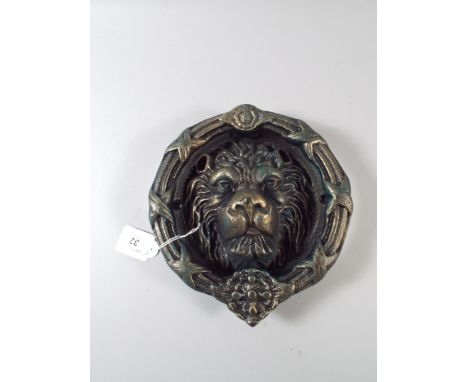 A Large Cast Metal Circular Lion Mask Door Knocker. 