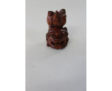 A signed Chinese box wood netsuke 