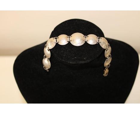 A vintage silver coin bracelet 