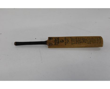 A vintage minature box wood cricket bat with facsimilie signatures for 1963 28cm long 