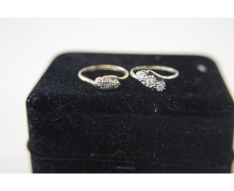 A 9ct gold &amp; platinum ring with three diamonds 2 grams An 18ct gold &amp; platinum ring with diamond detail 2.2grams 