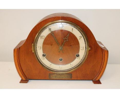 A vintage wooden mantel clock 