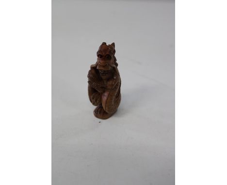 A Chinese box wood netsuke 
