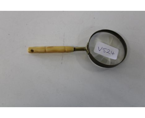 A vintage bone handled magnifying glass 16cm tall 