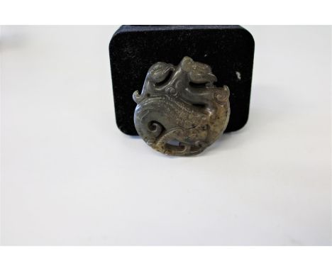 A Oriental carved jade amulet 5cm 