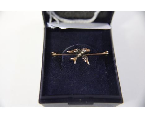 A 9ct gold &amp; seed pearl brooch in the form of a bird 