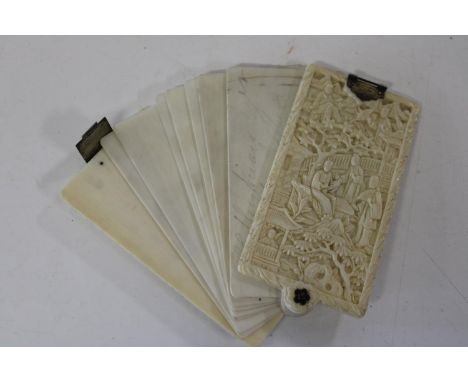 A antique finely carved Chinese ivory Aide Memoire with thin ivory sheets for writing. 8.5cm x 5cm. Inscription on one panel 