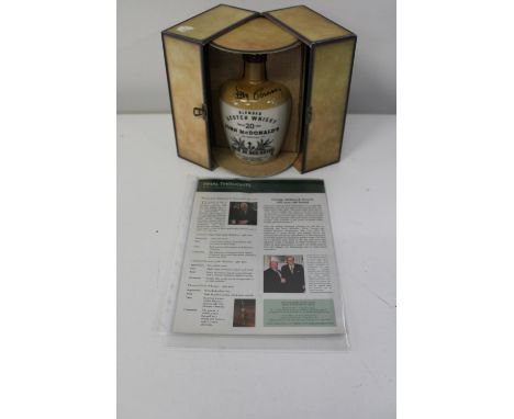 A cased &amp; unopened bottle of John McDonalds blended twenty year old scotch whisky, signed by Sean Connery with COA 