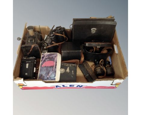 A crate of vintage cine and box cameras, Magic lantern, vintage field glasses, cut throat razors etc 