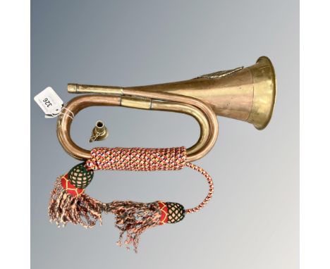 A copper and brass bugle with facsimile Argyll and Sutherland Highlanders badge 