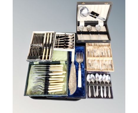 A tray of several cases of epns and stainless steel cutlery, plated candlestick 