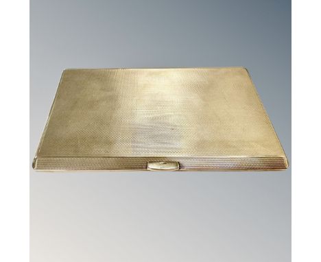 A 9ct gold cigarette case with engine turned decoration, Birmingham marks, length 127mm.  CONDITION REPORT: 180.4g