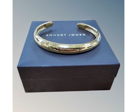 An Ernest Jones silver-gilt bangle, boxed.   CONDITION REPORT: 14.9g