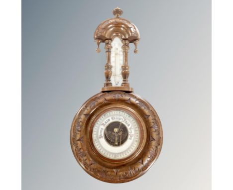 A carved Edwardian barometer 