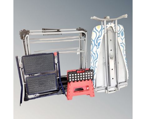 A folding ironing board together with two folding clothes airers and a two tread hailo folding stool step together with two f