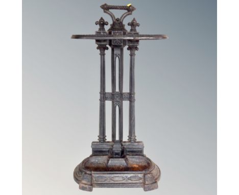 A 19th century cast iron stick stand with lift out tray 