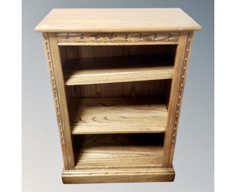 A contemporary Ercol bookcase in an oak finish 