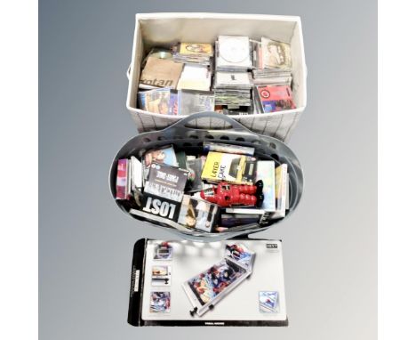 A box and crate of assorted DVD's and CD's, boxed table topped pin ball machine and contemporary mechanical robot 