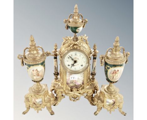 An ornate reproduction three piece clock garniture set 