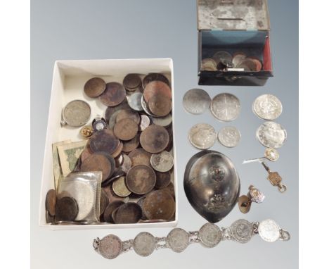 A box containing a miniature tin money box, 19th and 20th century foreign and British coinage to include silver coins, enamel