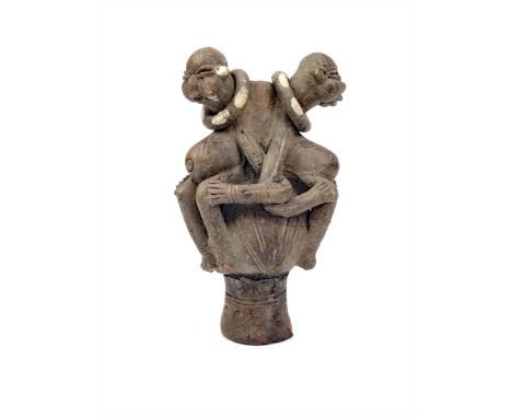 TIKAR OIL LAMP, pottery, clay, three figures entwined, one removable head (missing), mid 20th century, 22cm Provenance: Colle