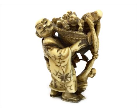 EARLY 20TH CENTURY JAPANESE IVORY NETSUKE, in the form of a man carrying a basket of smaller men, 5.5cm high