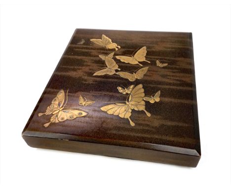 20TH CENTURY JAPANESE LACQUERED BOX, the rectangular detachable lid decorated with butterflies in gold enamel, 23cm x 25cm