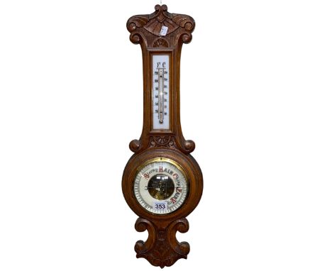 Carved oak barometer-thermometer, 58cm.