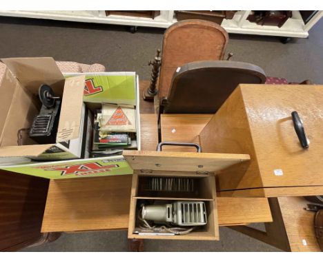 Vintage projector and reels, slide projector and slides.