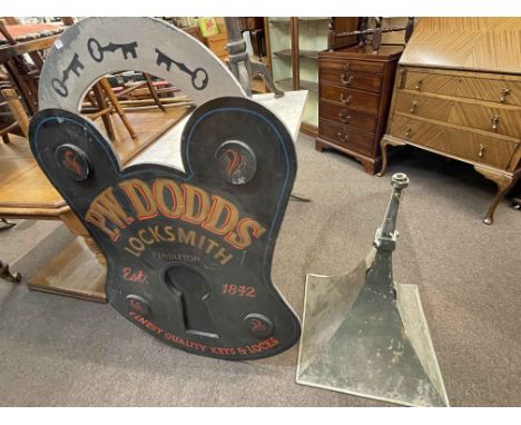 Wooden sign 'PW Dodds, Locksmith Pendleton' and tannoy speaker.