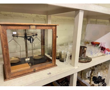 Cased set of balance scales, pair and single glass decanters, glassware, coloured glass including paperweights, brass horsebr