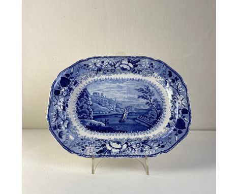 An early 19th century blue and white pearlware platter by Pountney &amp; Allies C.1826 transfer printed with a view of Clifto