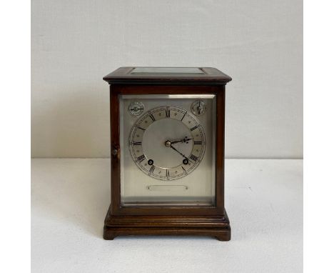 An early 20th century mahogany library or mantle clock by Winterhalder and Hofmeier having a silvered dial bearing Roman nume