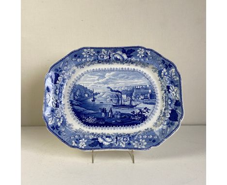 An early 19th century blue and white lead glazed earthenware meat platter by Poutney &amp; Allies, Bristol having a central t