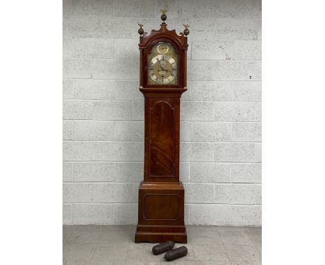A George III mahogany longcase clock by John Beard London having three brass ball eagle spire finials on a shaped fretwork pe