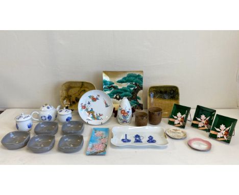 A mixed collection of contemporary Japanese items to include a miniature blue and white china teapot, sugar pots and a dish a